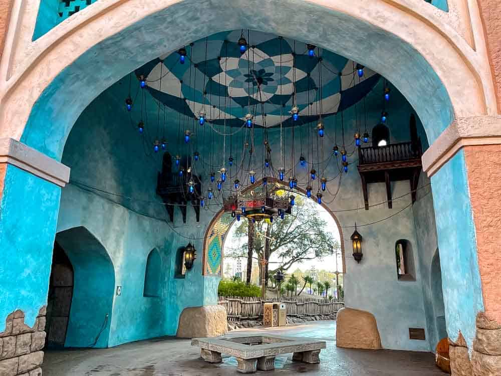Adventureland archway at Disneyland Paris during February, showing peaceful winter atmosphere and quieter walkways with Moroccan lanterns and blue tiles