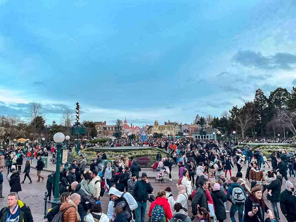 Crowds at Disneyland Paris in March gathered around Central Plaza and Main Street during a busy afternoon