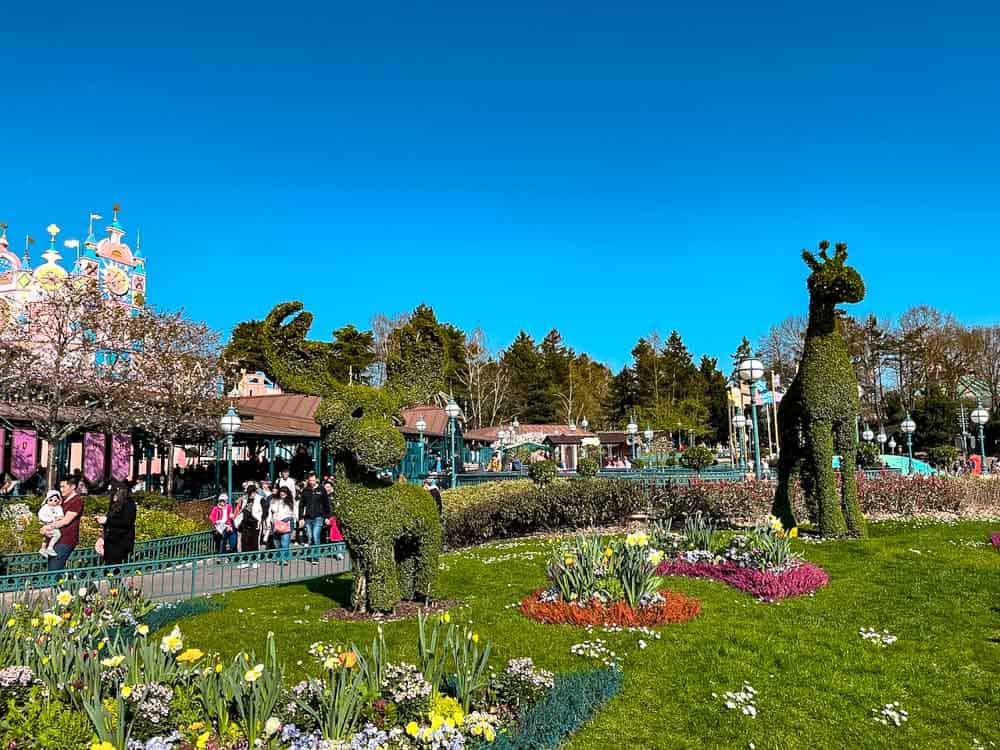 Spring flowers and character topiary at Disneyland Paris in March