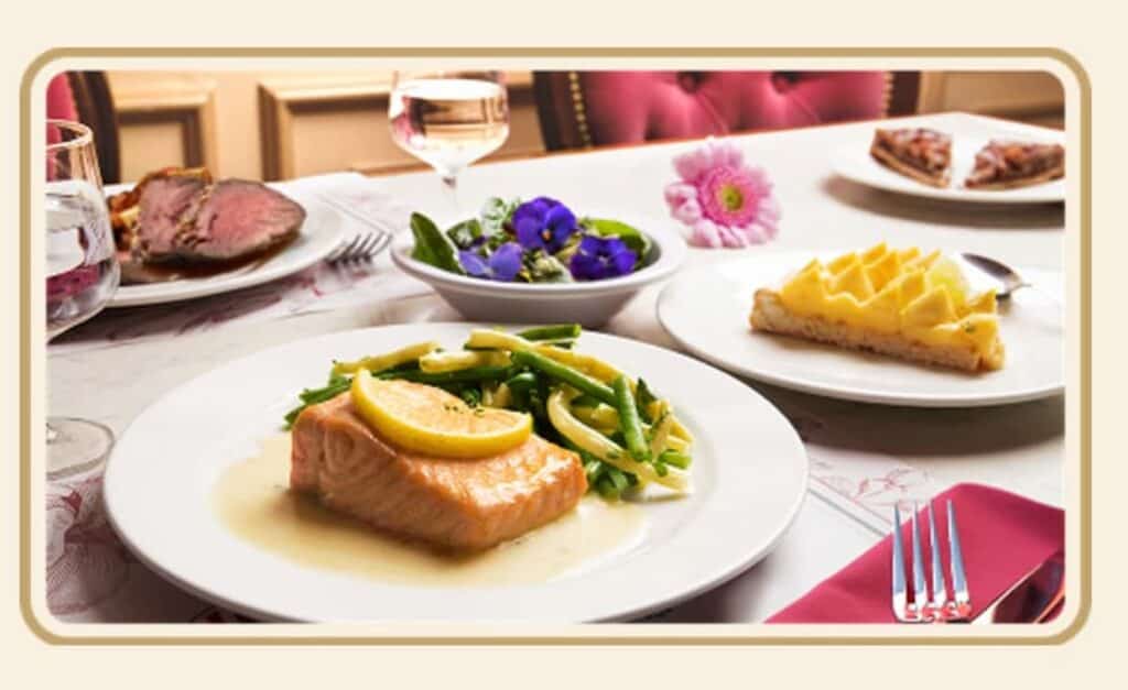 Seabream with lemon sauce and green beans from the Regal View menu Disneyland Paris, served alongside salad, steak and citrus tart dessert.