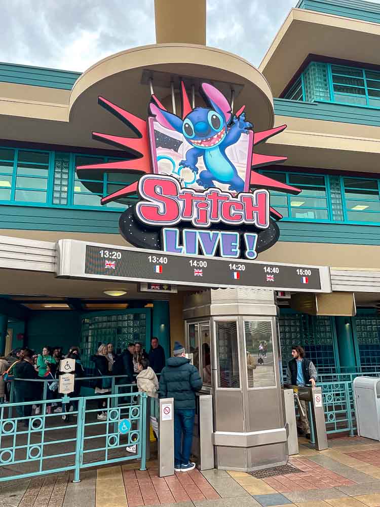 Stitch Live entrance sign with showtimes displayed at Disneyland Paris Walt Disney Studios Park.