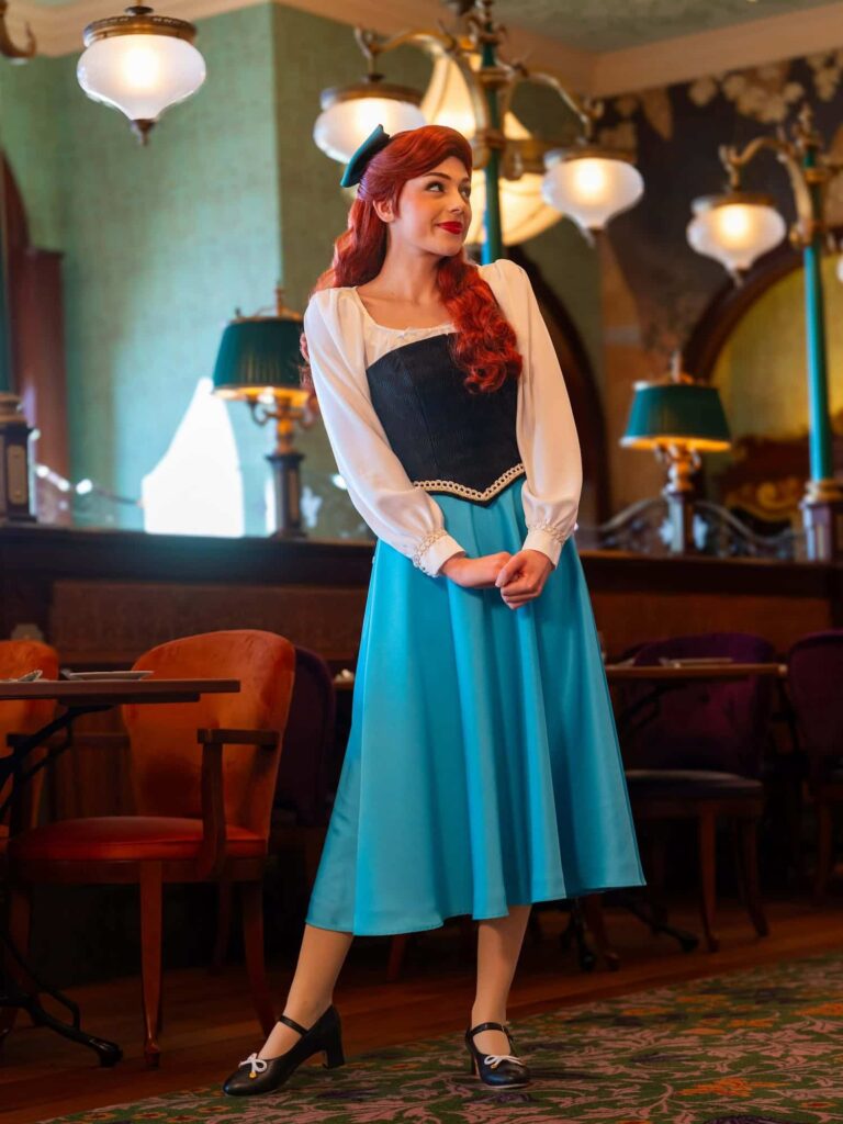 Princess Ariel wearing her blue town dress appearing as one of the Regal View princesses at Disneyland Paris