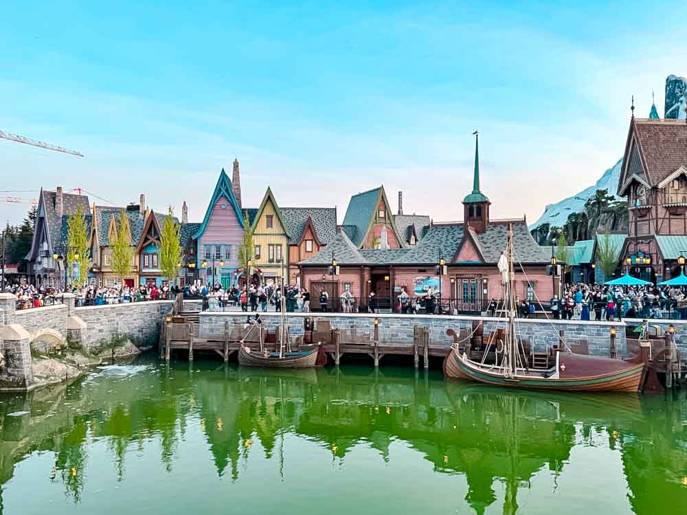 Arendelle harbour with boats and waterfront buildings in World of Frozen at Disney Adventure World Disneyland Paris