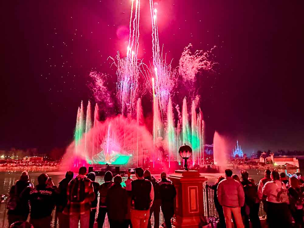 Fireworks and water effects during Cascade of Lights show at Disney Adventure World Disneyland Paris