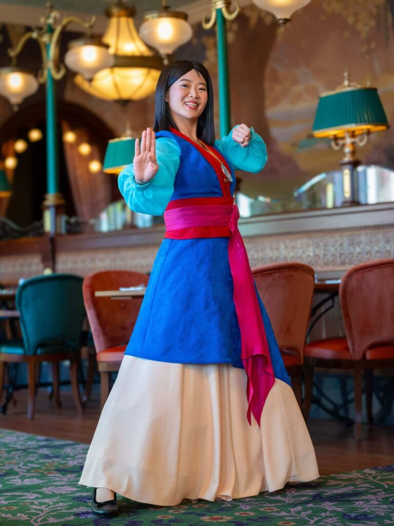 Mulan wearing her red and blue hero outfit appearing among the Regal View princesses at Disneyland Paris