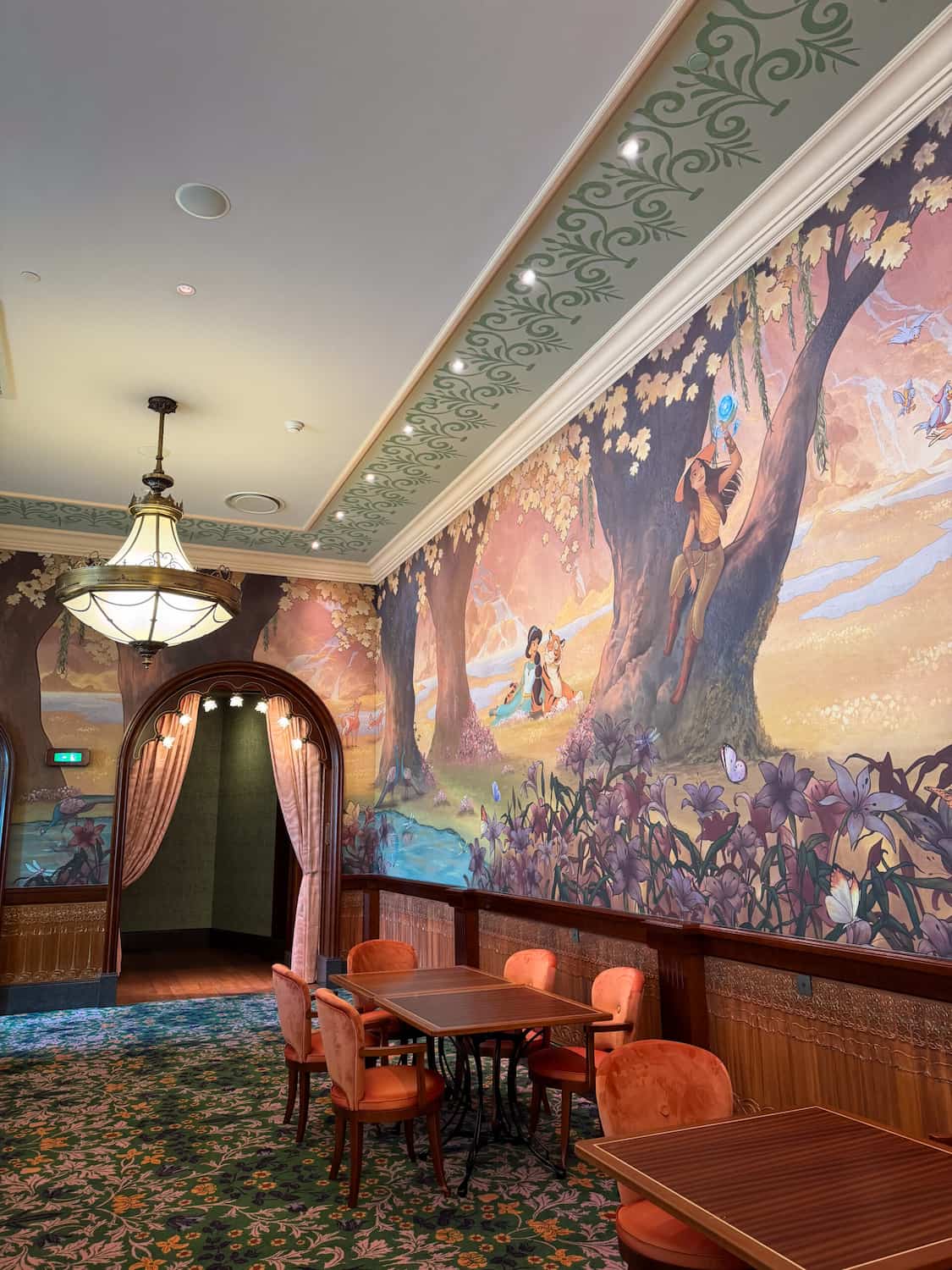 Large princess mural inside the Regal View restaurant at Disneyland Paris featuring Raya, Jasmine and Cinderella