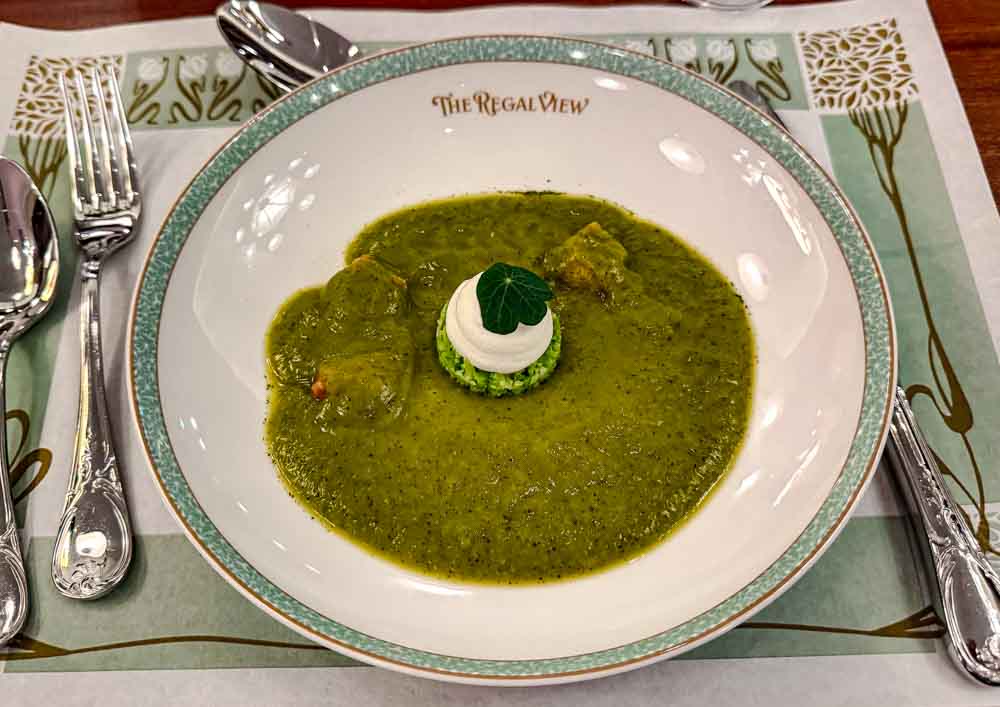 Vegetarian soup starter, the courgette velouté with cauliflower tabbouleh and corn fritter at Regal View Restaurant Disneyland Paris