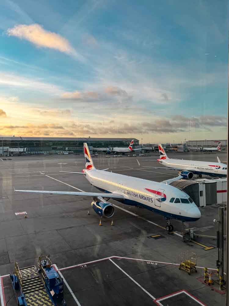 British Airways plane parked at the gate at sunrise, Charles de Gaulle Airport, for a Disneyland Paris flight home