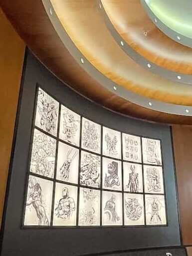 The Downtown Restaurant Disneyland Paris seating area is decorated with comic pages showing different superheroes.