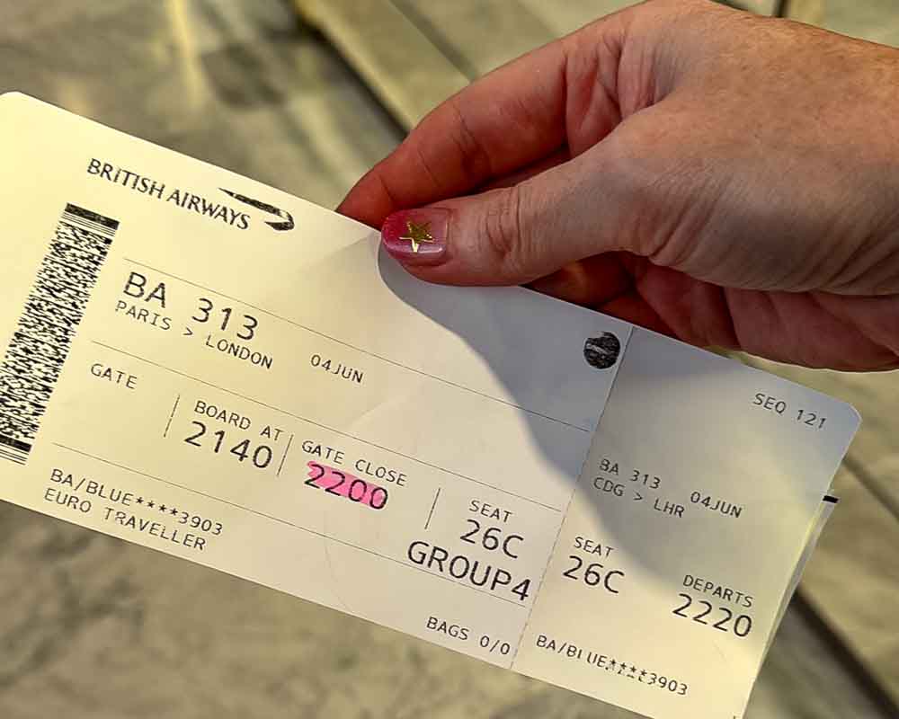 British Airways boarding pass showing flight BA313 from Paris CDG to London Heathrow