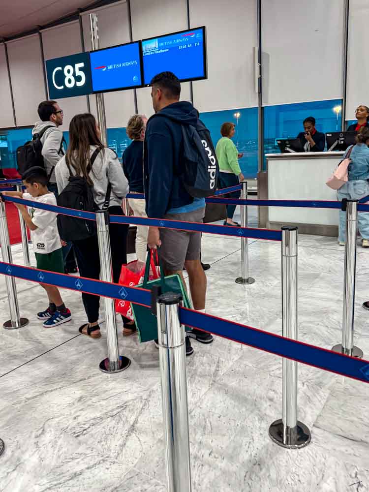 Families queuing at Gate C85 for a British Airways flight home from Charles de Gaulle Airport for Disneyland Paris
