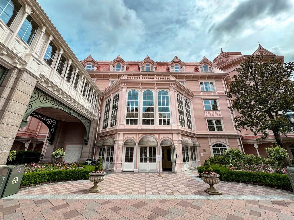 Posh pink guest entrance with a welcoming door open as in the Disneyland Hotel Paris review