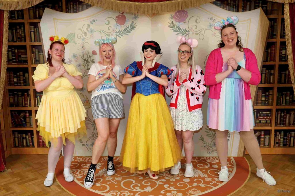 Four ladies meeting Snow White during the Royal Encounter in Disneyland Hotel at Disneyland Paris
