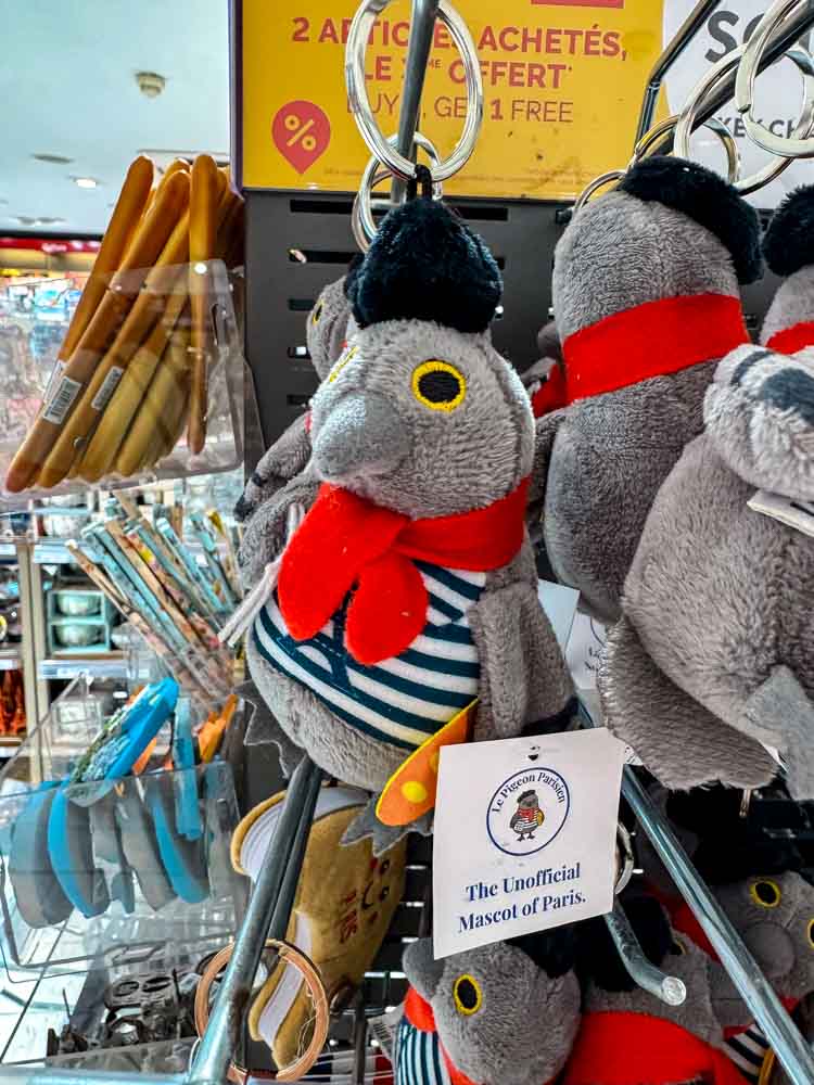 Le Pigeon Parisien plush keyring, the unofficial mascot of Paris, in a CDG airport gift shop